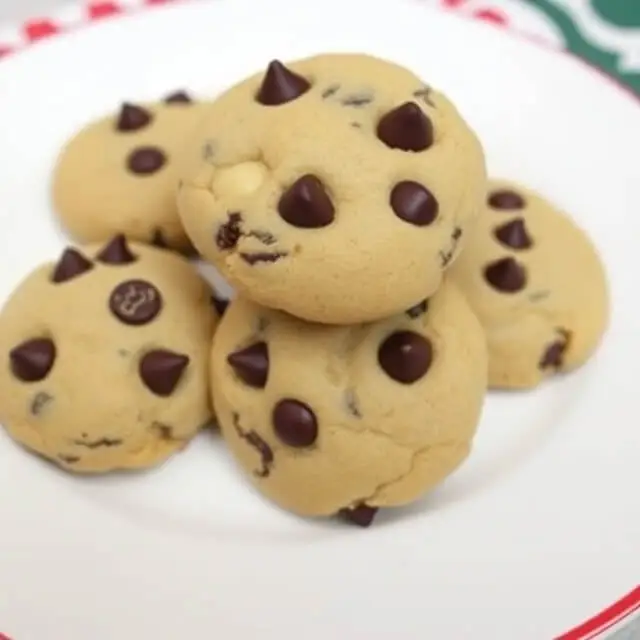 A tray of golden-brown chocolate chip cookies fresh from the oven.